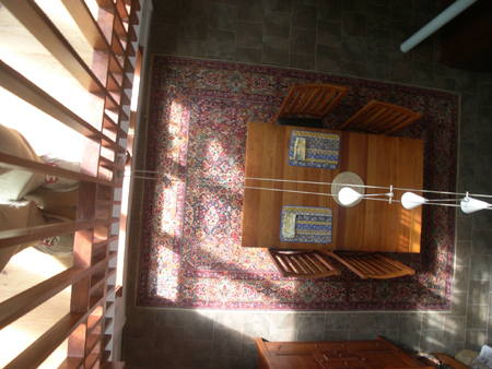 looking down to the dining/kitchen floor that accesses the rear yard