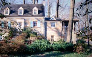 Front of the house-main house, enclosed porch (now living room), and new porch over ground-floor family room